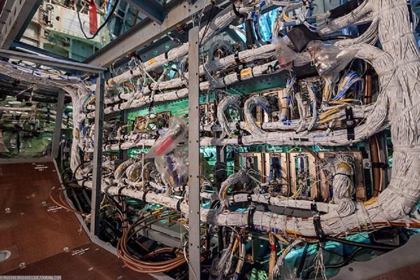 A picture of what an electrical wiring installation job typically looks like. Mechanics must route thousands of wires by hand through aircraft structure.